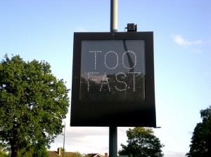 Photo of a roadsign saying 'too fast' by http://www.flickr.com/photos/sumlin/